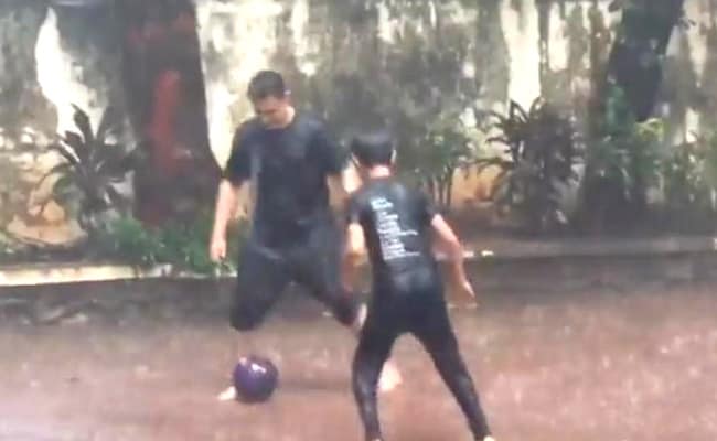 Viral Video: Aamir Khan spotted seeing playing football with son Azad in Mumbai rain