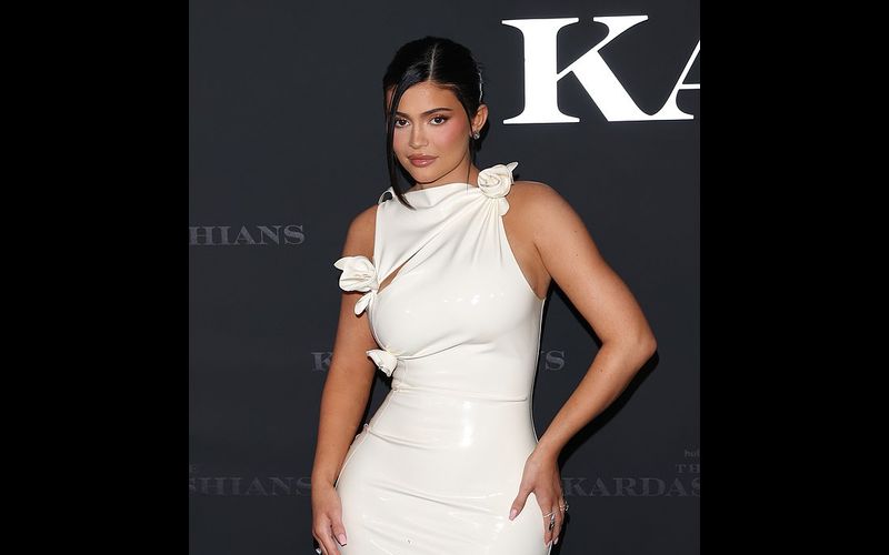 In an all white latex ensemble, Kylie Jenner invents a Minimalist Regalia