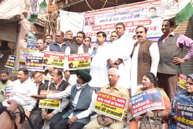 Delhi Congress workers hold dharna outside liquor vends to protest against the new Excise Policy.
