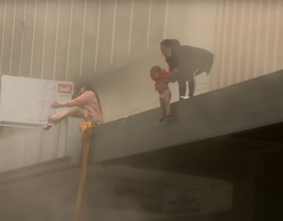 Woman throws her baby to safety from burning building in South Africa