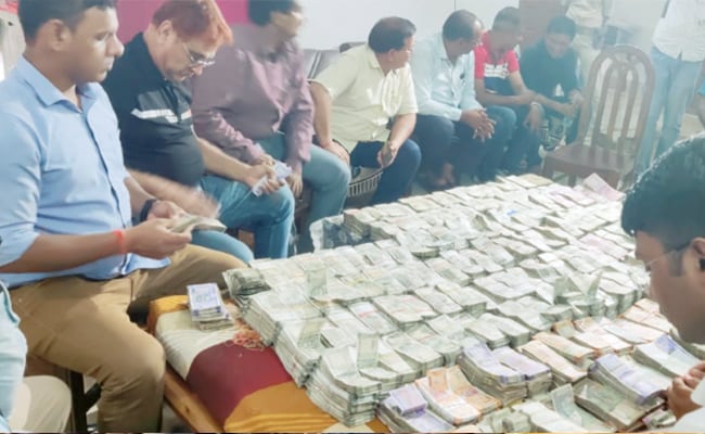 Crores of black money found in a Drug inspector's house in Bihar, luxury cars, and Plot documents recovered 