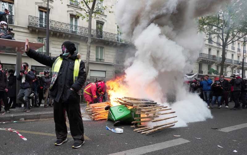 Demonstrators protest in Paris and other French cities on May Day