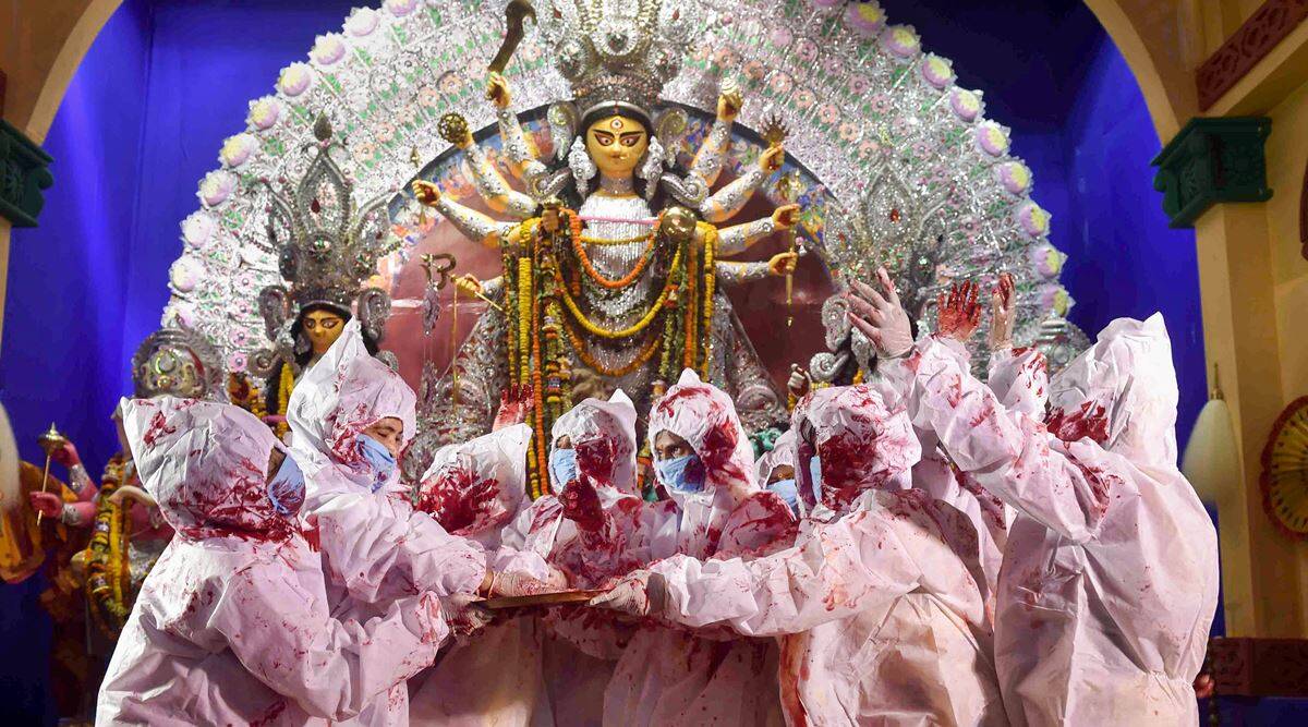 Durga Puja 2021: ladies participate in sindur khela carrying PPE kits in Kolkata Pandal